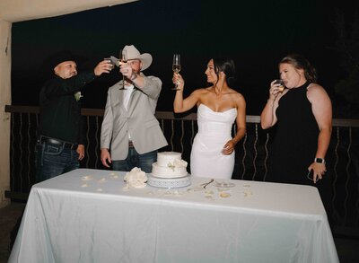Bride and groom toast with a small reception at the Diamond Pavillion near Chapel Dulcinea
