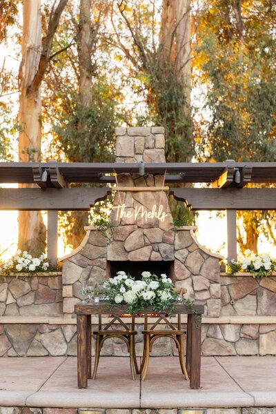 sweetheart table with neon sign at outdoor los angeles wedding venue