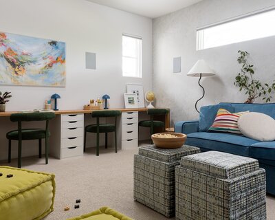 A media room with blue sofa