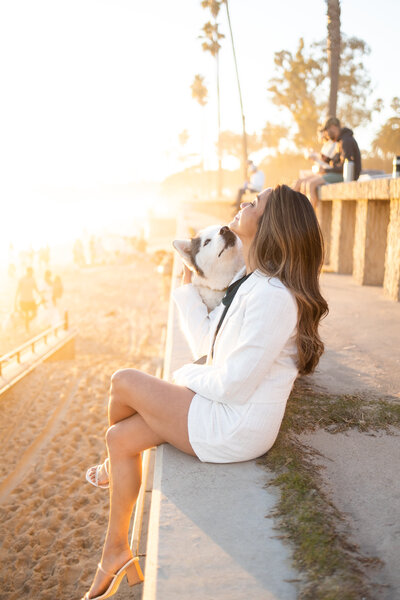 Jill Agonias Santa Barbara Realtor with her dog  at Butterfly Beach in Montecito