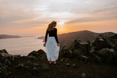 Bride getting solo portraits on her multi day elopement in Santorini Greece