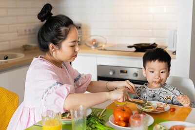 Mom at the breakfast table with her son. 