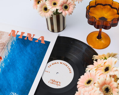 Personalised vinyl record flowers in vase and amber champagne glass