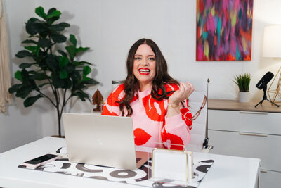 heather crabtree smiling in pink and red sweater