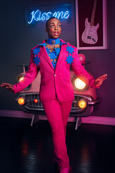 Stylish portrait of Todrick Hall in an extravagant, feathered outfit, exuding confidence, photographed by Ylva Erevall.