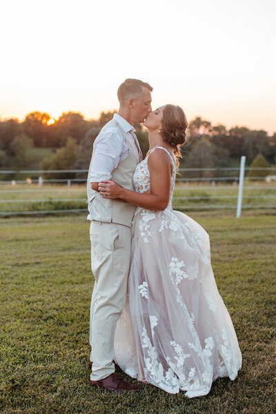 bride and groom kiss St. Louis Wedding Photographers