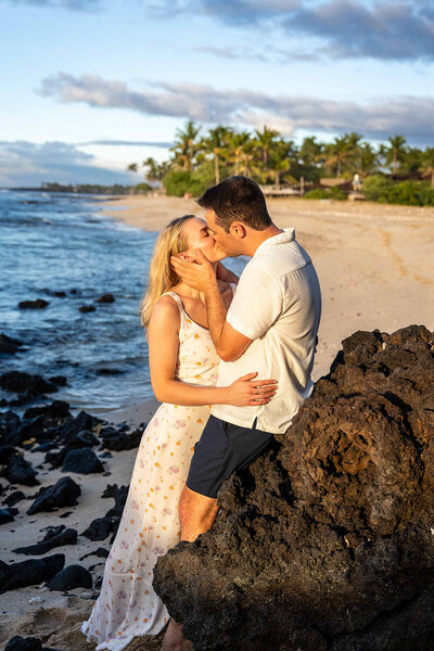 hawaii couple photography on the beach with couple kissing