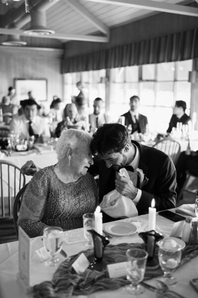 groom having an emotional moment with his grandma at Tennessee wedding reception 