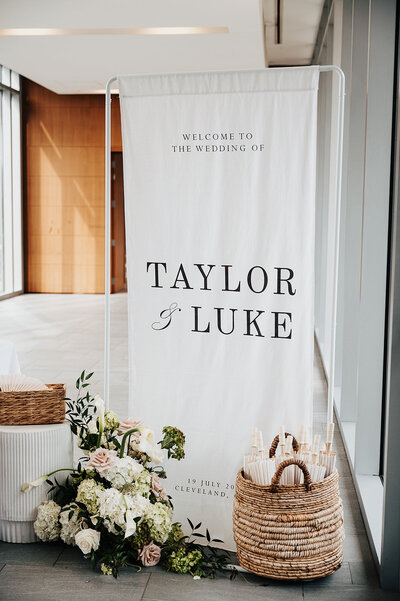 grooms walking with guests on either side holding sparklers