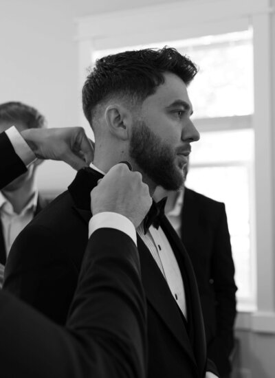 A groom getting ready representing the team of bridal show vendors one can meet at the Crush Collective wedding expo.