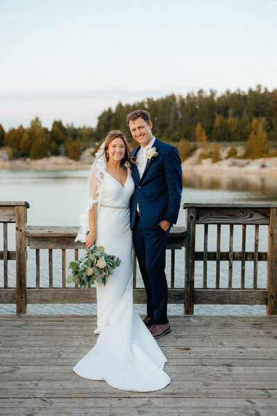 bride and groom pictures on a dock on Lake Michigan