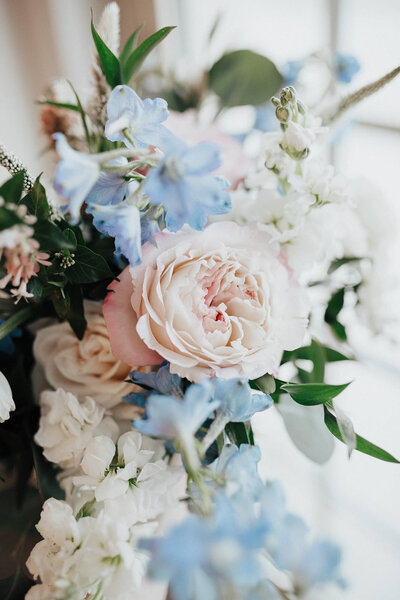 Bridal bouquet with blue, pink and white flowers