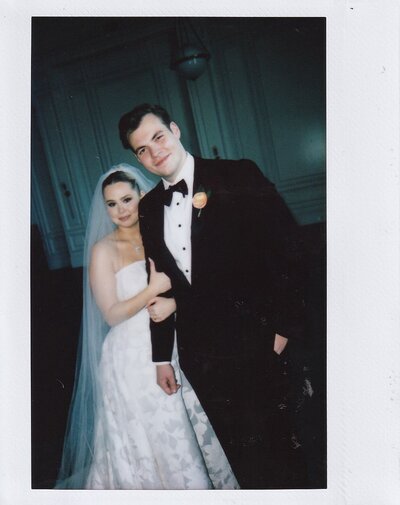 A nostalgic Polaroid-style wedding portrait of a bride and groom at The Adolphus Hotel in Dallas, capturing a timeless and intimate moment.