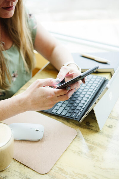 Realtor Tamara using her phone negotiating with home buyers