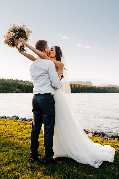 Bride and groom kissing at Flathead Lake Forevers in Big Arm, MT