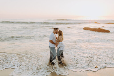 Natural Candid Documentary Family Maternity Baby Pregnancy Announcement Photo shoot at La Jolla Windansea beach at sunset - Couples Mom and Dad San Diego Maternity Photographer