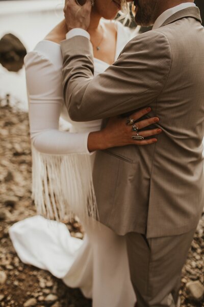 Couple embracing at mountain elopement