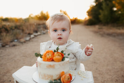 cake smash photos with baby girl outdoors denver co