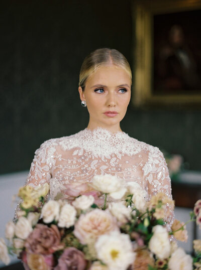 Bride carrying flowers with makeup by Jessica Rose at St.Giles Dorset