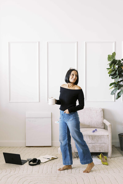 Tarah Baiman of Smashing Sales holding coffee and smiling