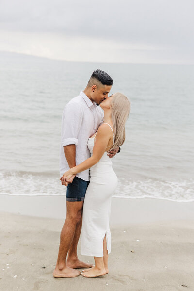 couple kissing on beach