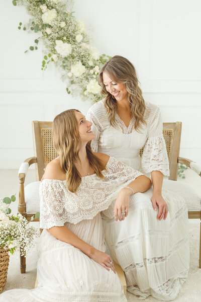 Mother and daughter looking at each other during the motherhood session