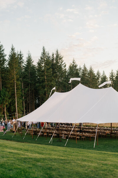 Elegant outdoor sailcloth tent wedding on Camano Island, planned and coordinated by Seattle wedding planner Wander Event Co.