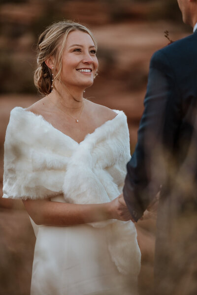 bride smiling at groom