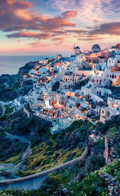 Santorini Caldera at sunset, with text reading "unforgettable incentives" over the top