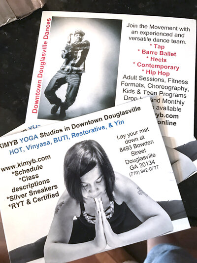 photos of printed cards with  woman with black hair in yoga pose and black man dancing branding