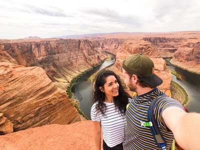 couple standing at horseshoe bend
