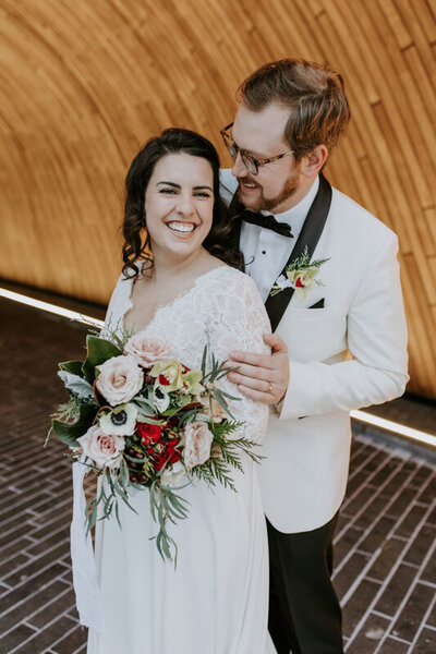 Elegant winter microwedding in downtown Calgary, lace bridal gown from Lovenote Bride, a modern bridal boutique based in Calgary + Vancouver. Featured on the Brontë Bride Blog.