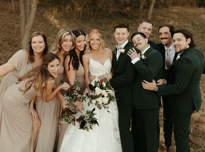 Wedding party portraits capturing bridesmaids and groomsmen with joyful expressions