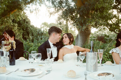 bride and groom embrace at wedding reception