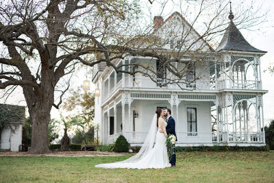 bride and groom dance during formal photos at The Farmhouse wedding venue in Houston Texas by Swish and Click Photography