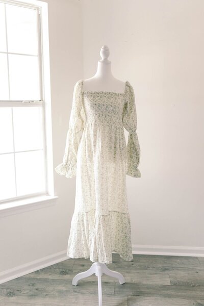 Women's white and green long sleeve pattern dress.
