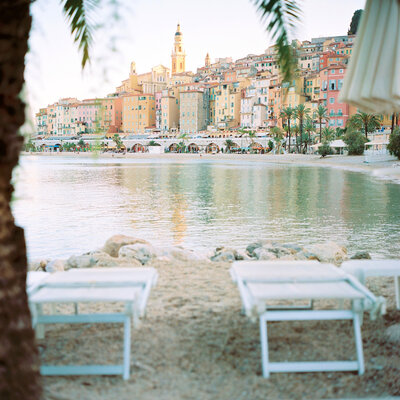 beach chairs line the water in the French Riviera