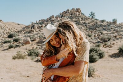 man hugging woman from behind