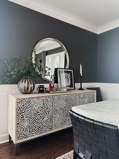 Styled dinning room with marble dinning table and a modern buffet