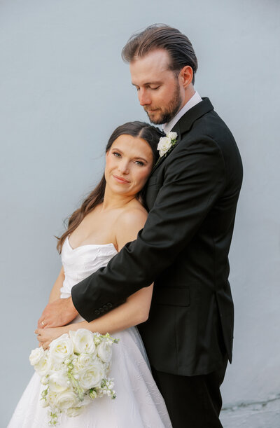 bride and groom embracing