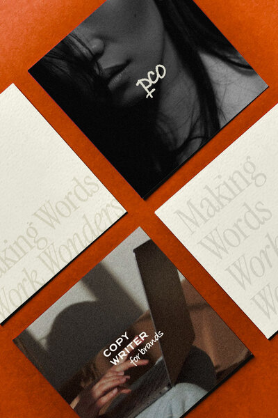 Square paper laying flat on orange fabric 