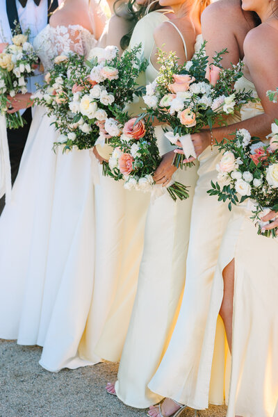 yellow bridesmaid dresses and colorful bridesmaids bouquet