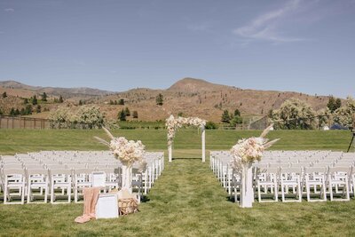 Floral White Ceremony Backdrop - Mikayla & Mario | Harmony Meadows Wedding - Lake Chelan Wedding