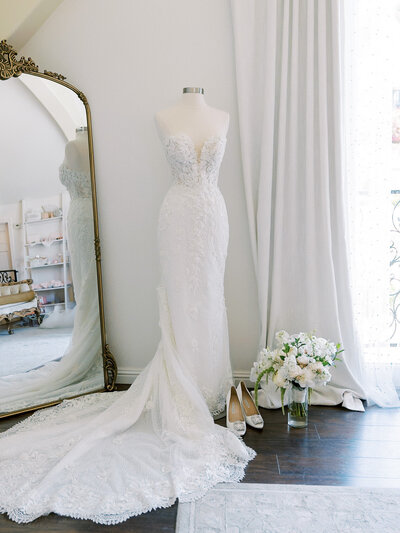  wedding dress on a mannequin before a luxury wedding at chateau Noland in San Luis Obispo