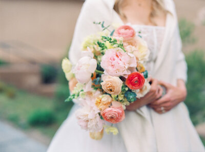 Bride holding colorful wedding bouquet at her Bishop's Lodge Wedding.