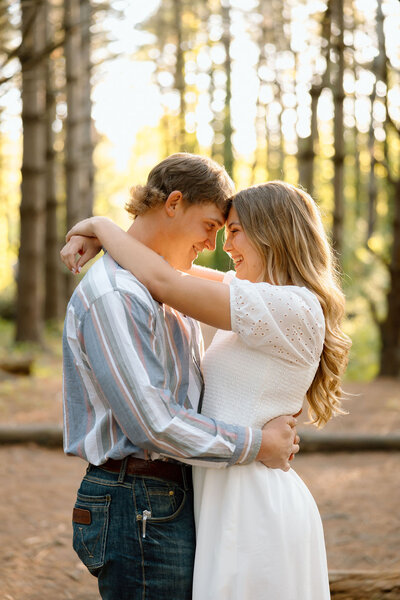 couple embrace during engagement photos