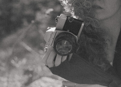woman hold a film camera