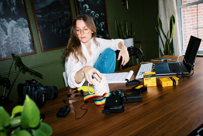 woman sits at work desk