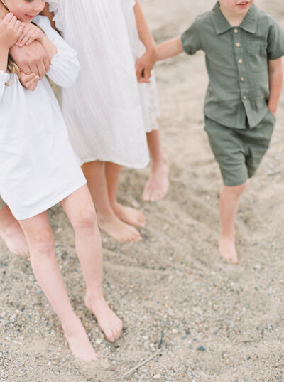 feet walking in the sand