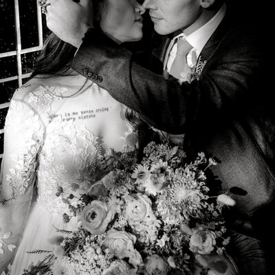 Black and white image of bride and groom at colorful fall South Congress Austin TX wedding